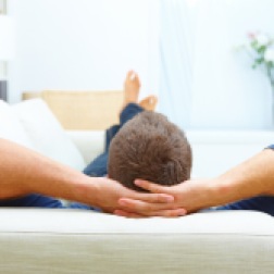 Portrait of male resting at home on his couch